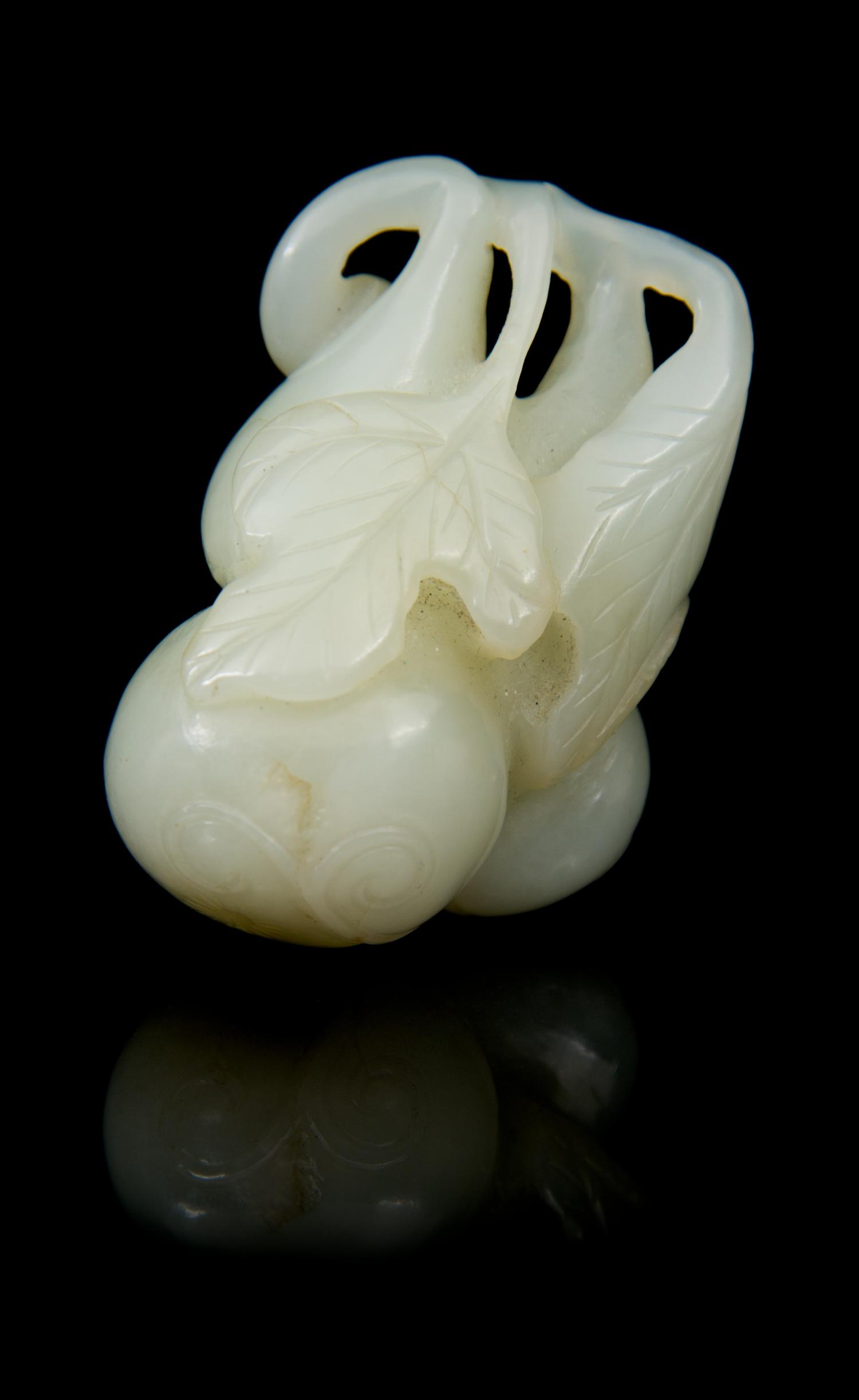 A Carved Jade Toggle Length 2 inches.