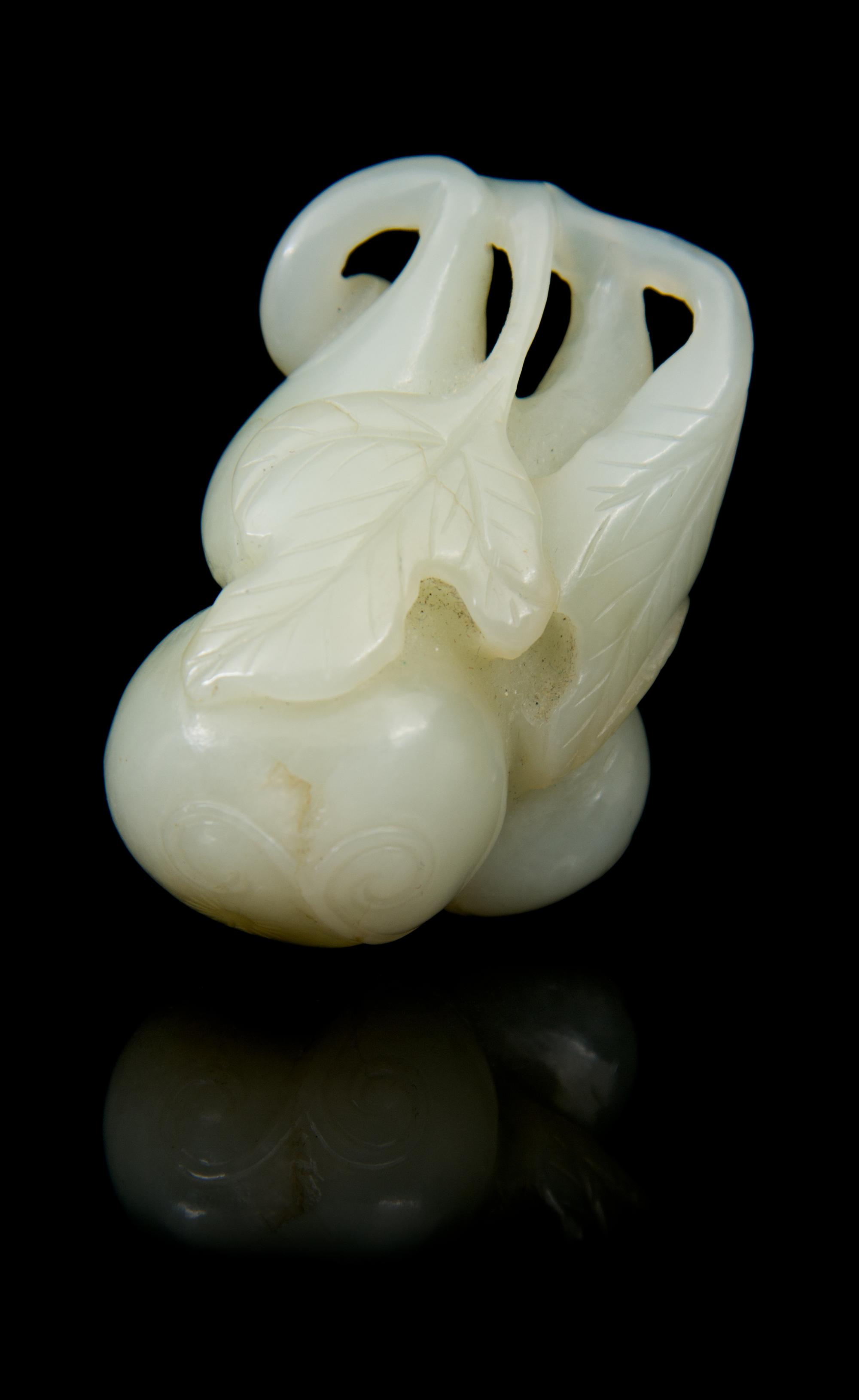 A Carved Jade Toggle Length 2 inches.