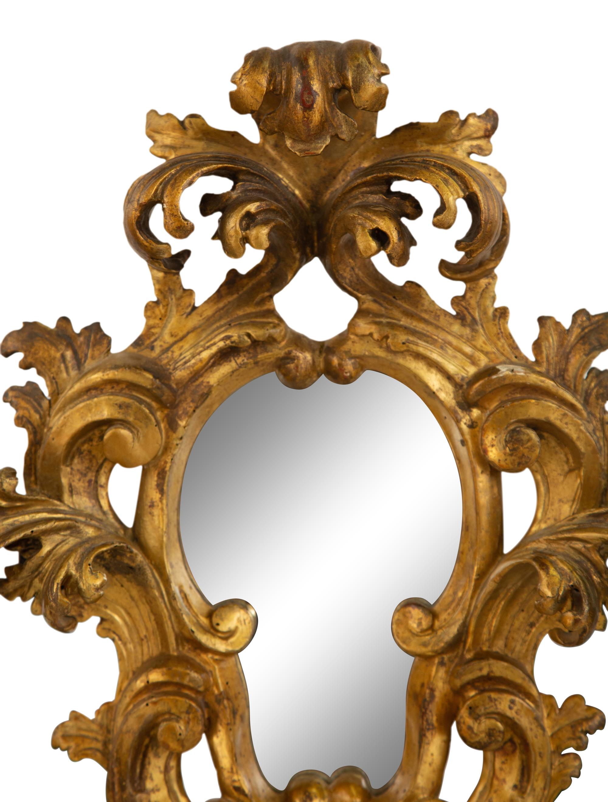 A Venetian Rococo Style Giltwood Mirror