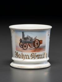 A Porcelain Occupational Shaving Mug Depicting a Steam Tractor