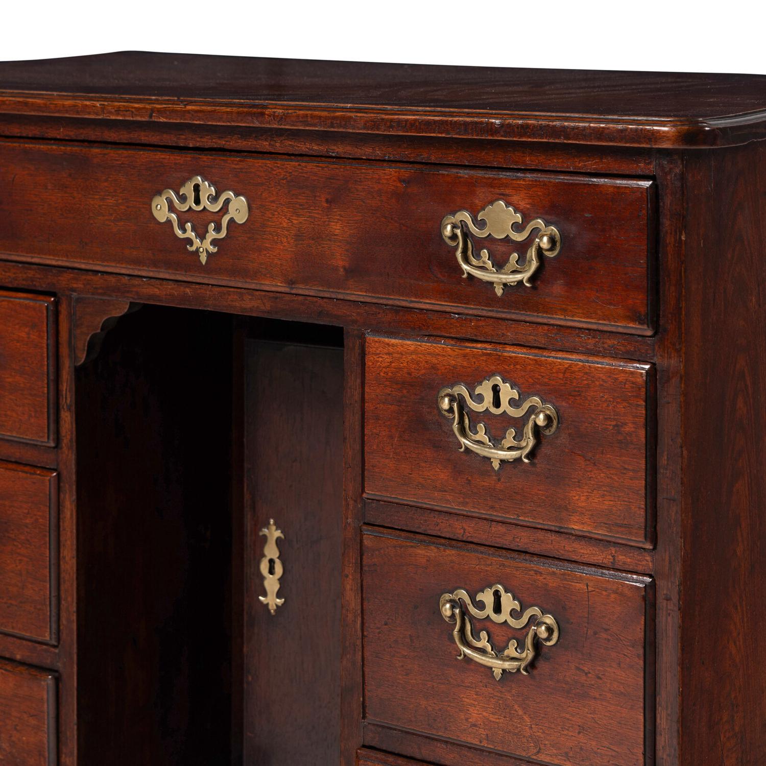 A George II Walnut Kneehole Desk