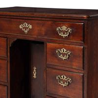 A George II Walnut Kneehole Desk