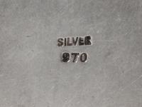 Four Silver Purse Articles, 20th Century, comprising a compact stamped sterling silver/37, a lipstick case stamped 950/silver, a pill b
