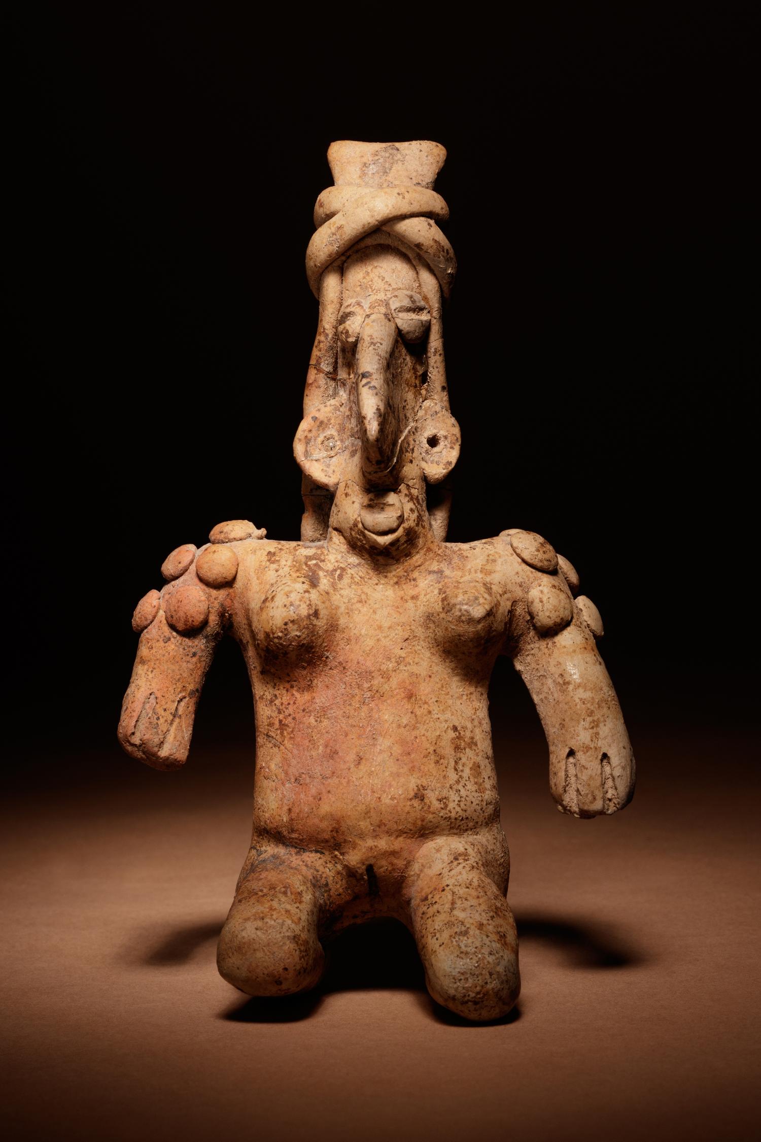 A Jalisco Terracotta Kneeling Figure