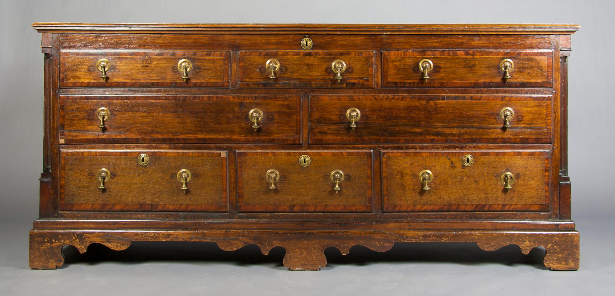 An English Oak Mule Chest, Height 36 1/2 x width 80 1/2 x depth 24 inches.