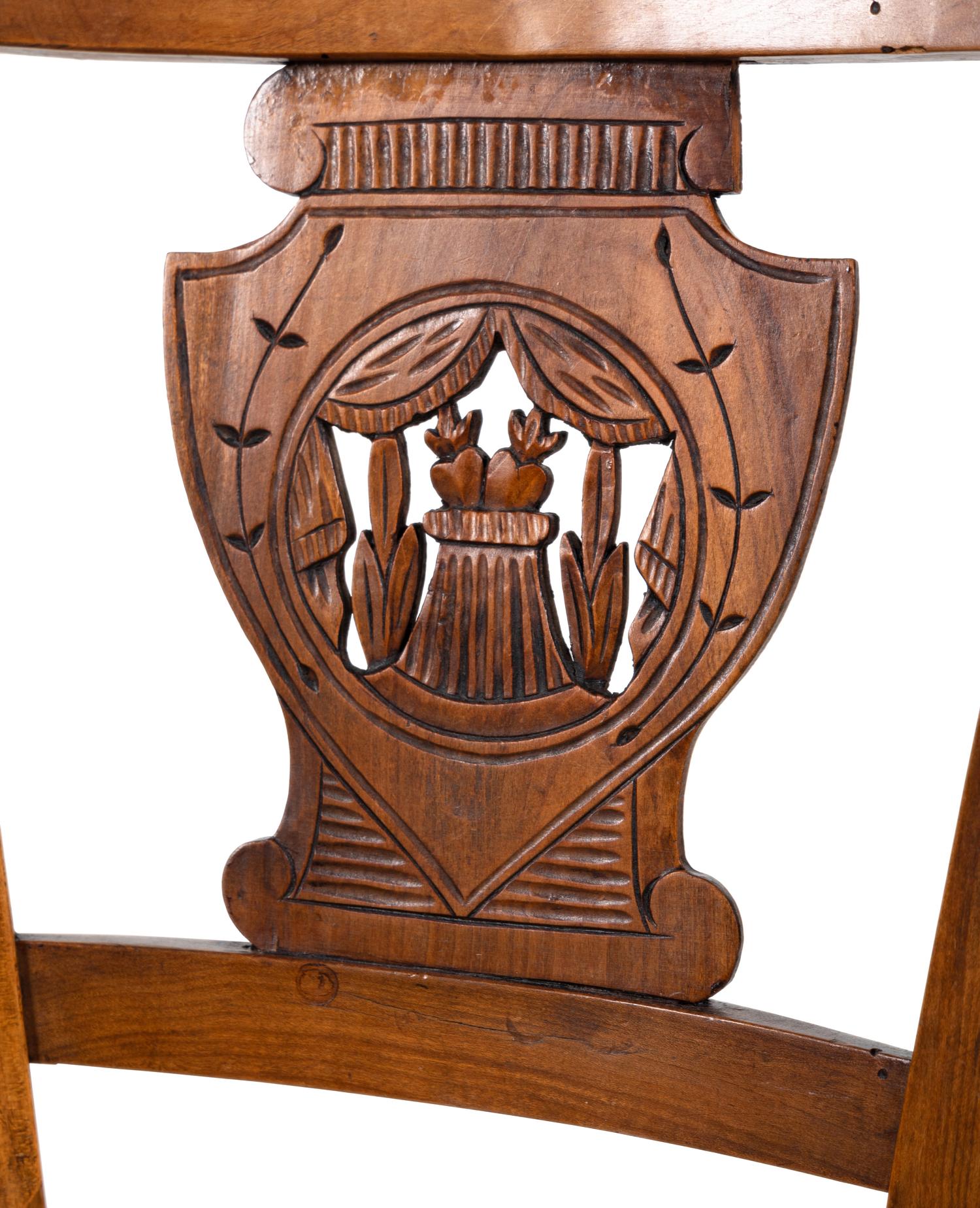 A Pair of Directoire Carved Walnut Rush-Seat Side Chairs