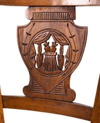 A Pair of Directoire Carved Walnut Rush-Seat Side Chairs