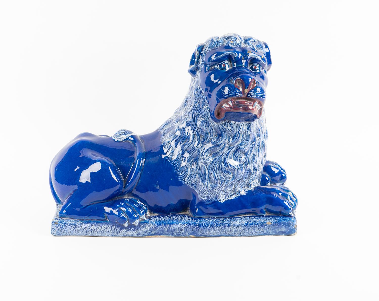 A Luneville Style Blue-Glazed Faience Recumbent Lion