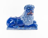 A Luneville Style Blue-Glazed Faience Recumbent Lion