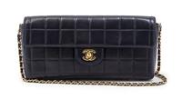A Chanel Navy Quilted Leather Convertible Flap Bag, 10 1/2 x 5 x 1 1/2 inches.