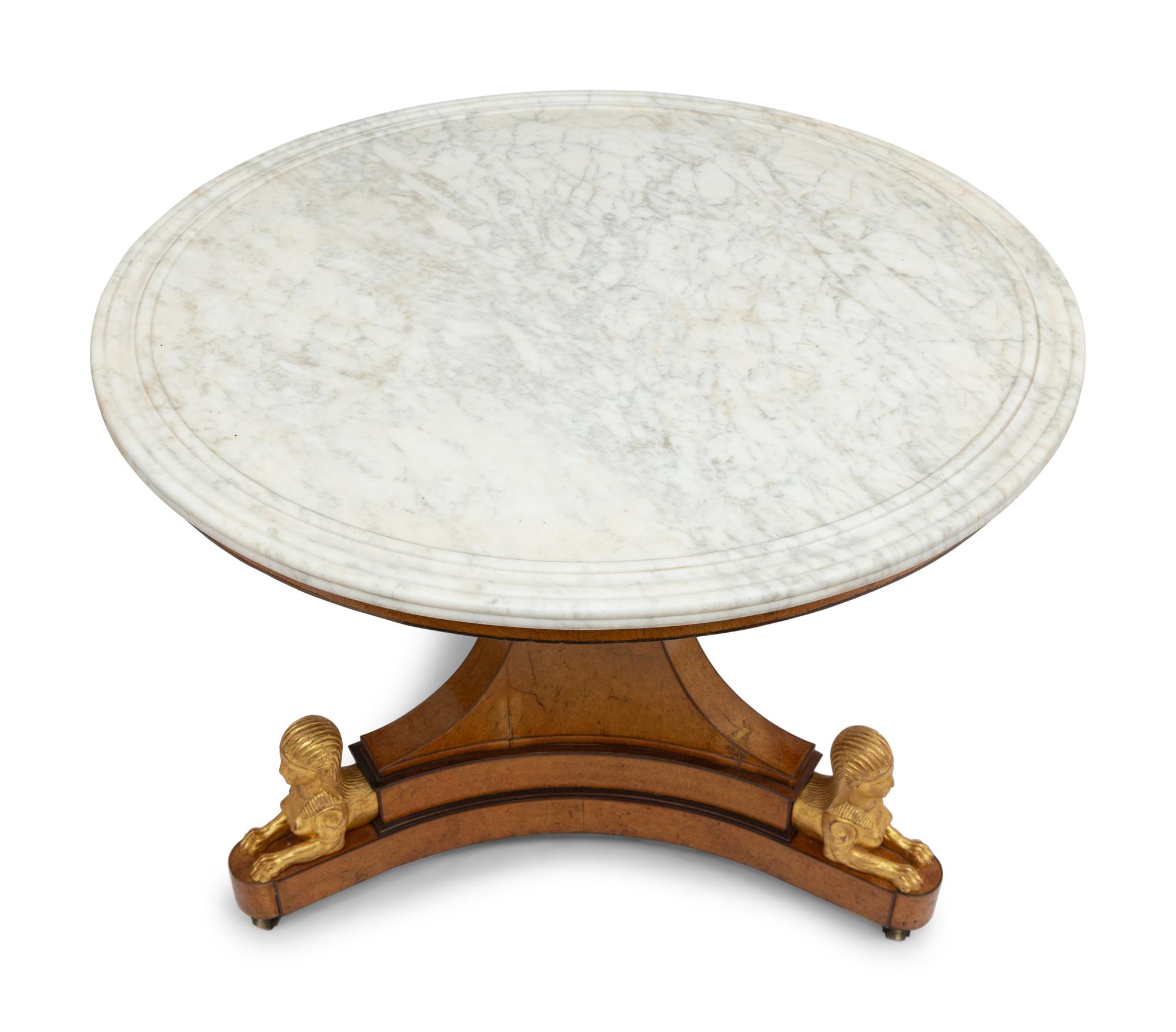 A Charles X Amboyna, Amaranth and Parcel Gilt Marble-Top Center Table