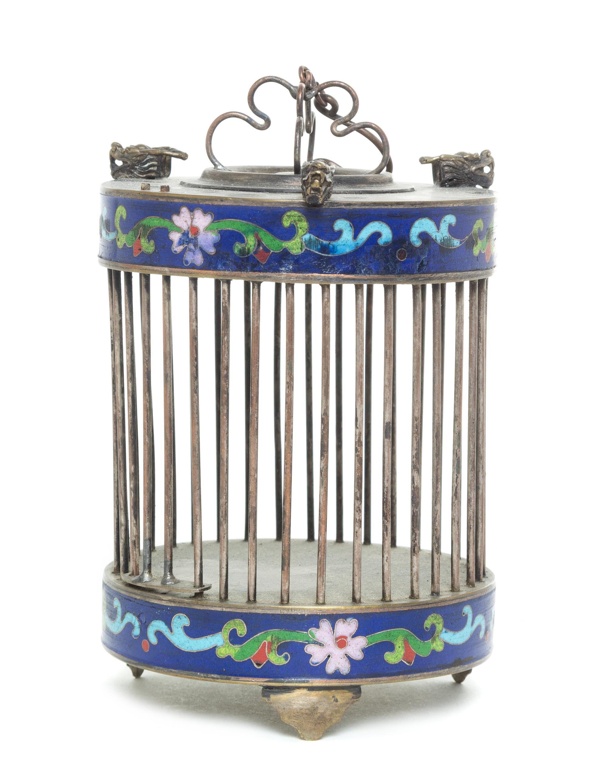 A Silver and Enameled Cricket Cage Height 6 inches.