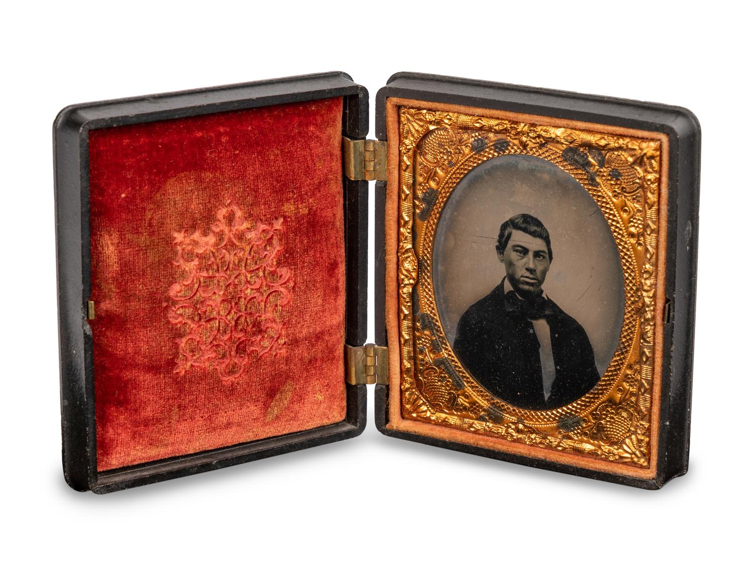 A Group of Four Tintypes of Men and a Woman