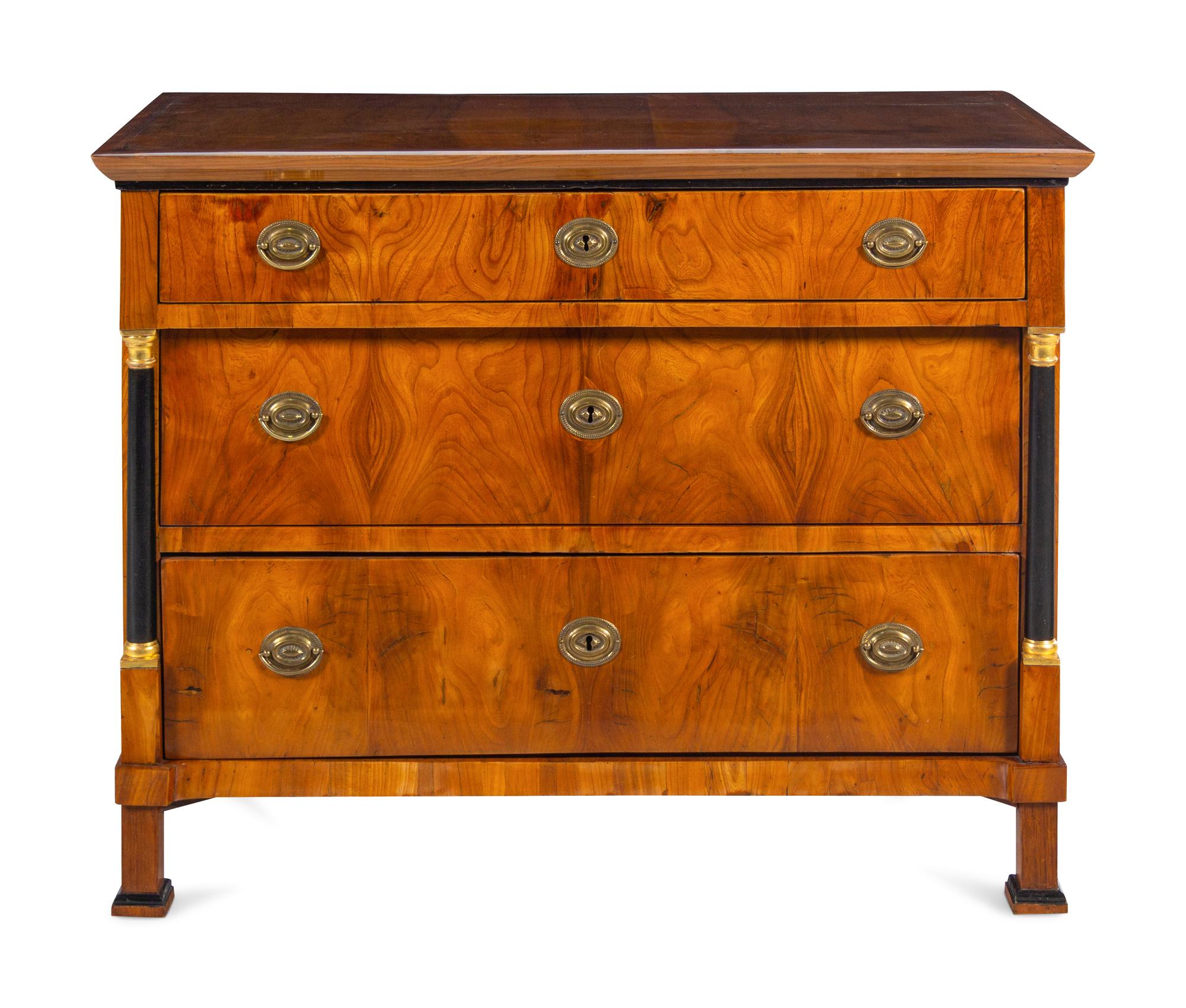 A Biedermeier Parcel Ebonized Walnut Commode