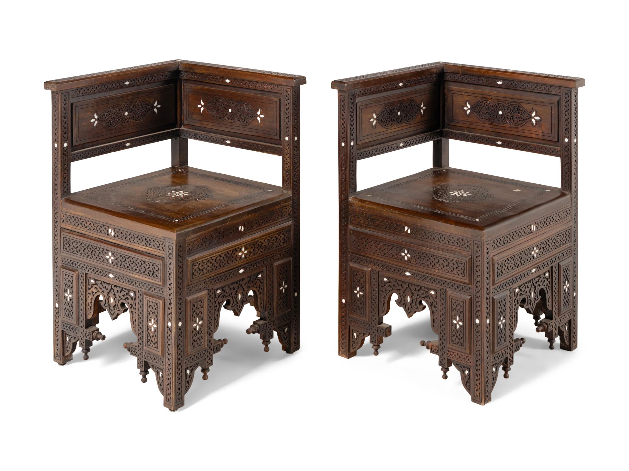 A Pair of Syrian Mother-of-Pearl Inlaid Carved Walnut Corner Chairs