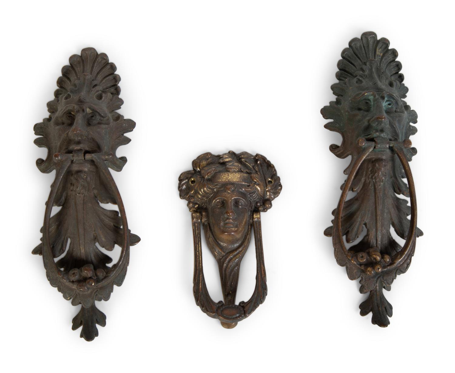 A Group of Three Continental Patinated Metal Door Knockers — 19TH CENTURY