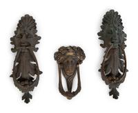 A Group of Three Continental Patinated Metal Door Knockers — 19TH CENTURY