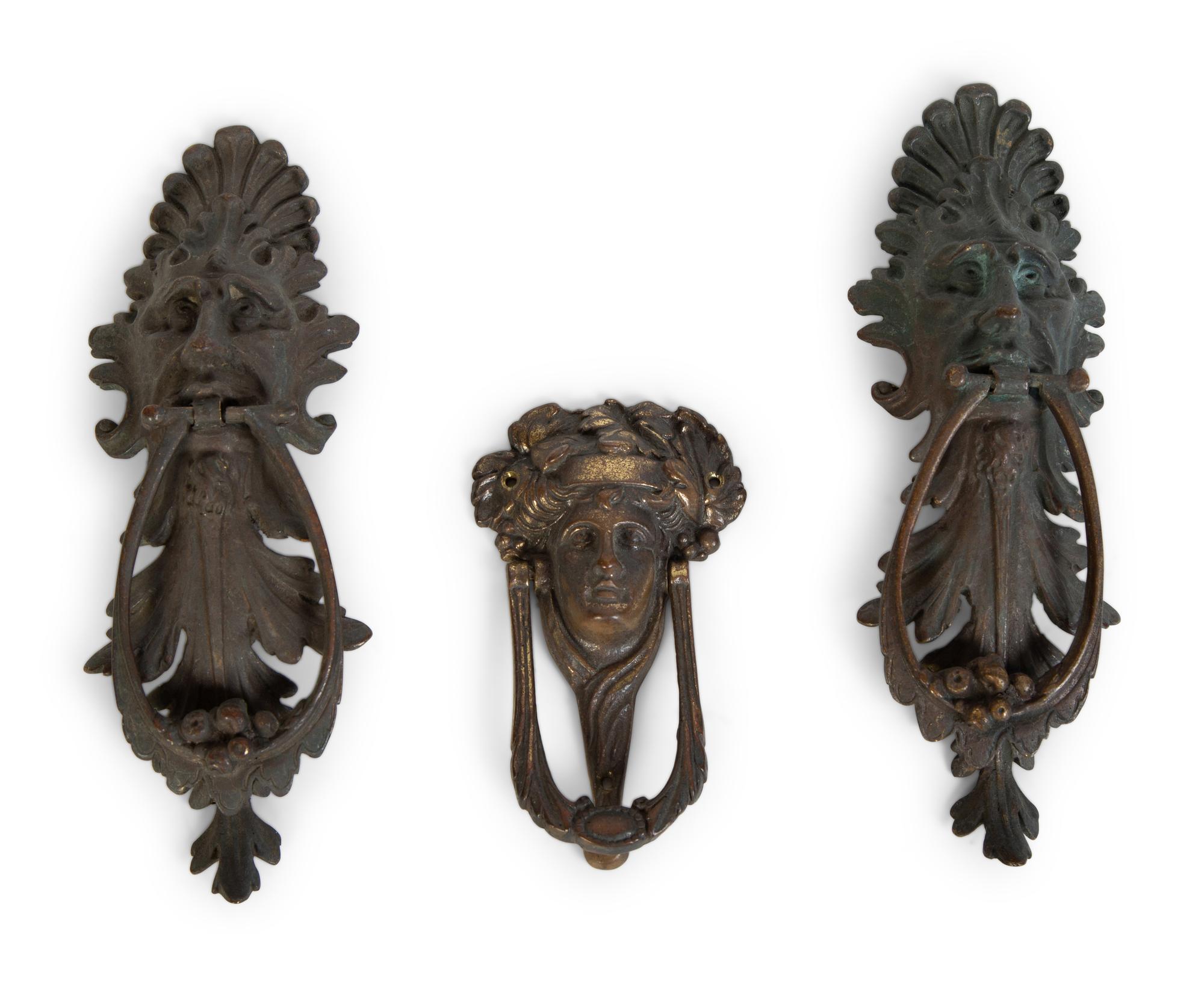 A Group of Three Continental Patinated Metal Door Knockers — 19TH CENTURY