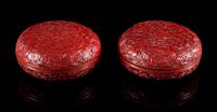 A Pair of Cinnabar Lacquer Covered Boxes Diameter of each 6 1/4 inches.