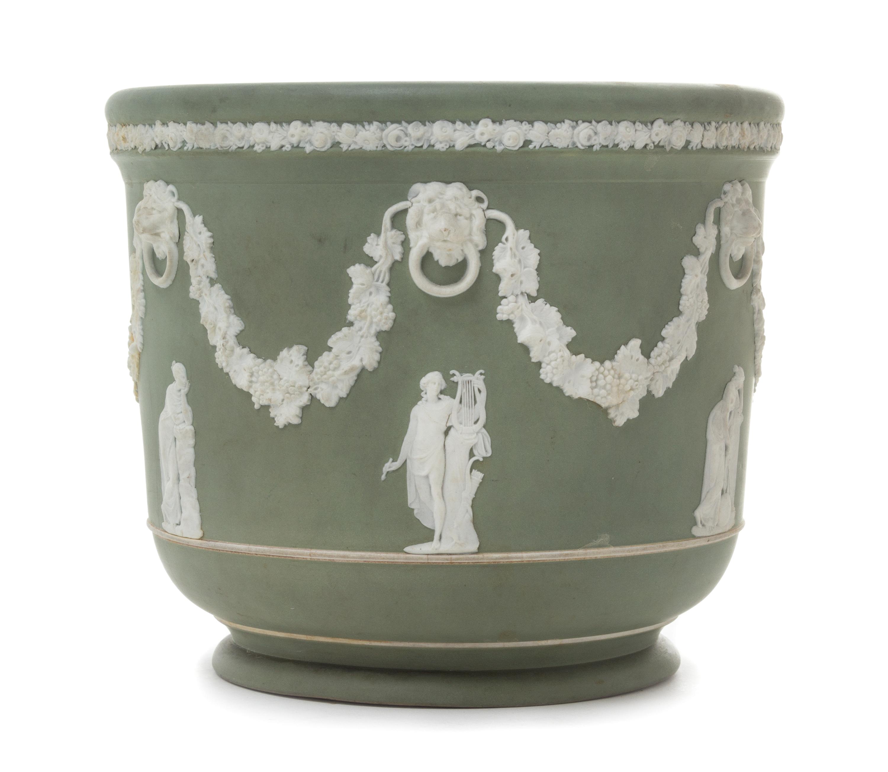 A Wedgwood Jasperware Jardiniere Height 7 1/8 x diameter 8 inches.