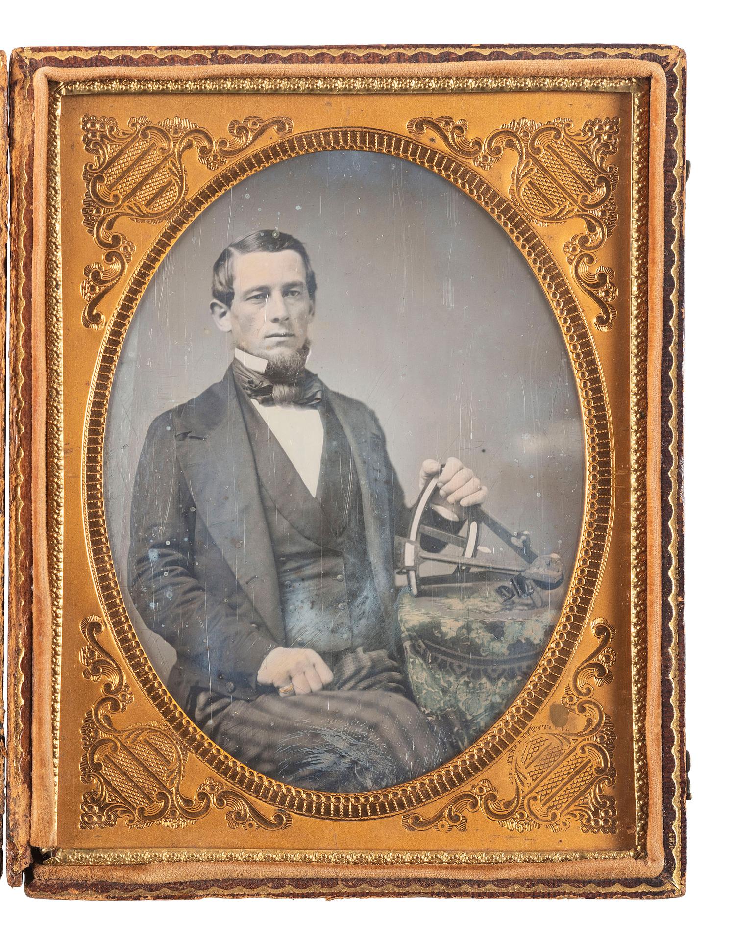 [EARLY PHOTOGRAPHY]. Half plate daguerreotype of a man holding a sextant.
