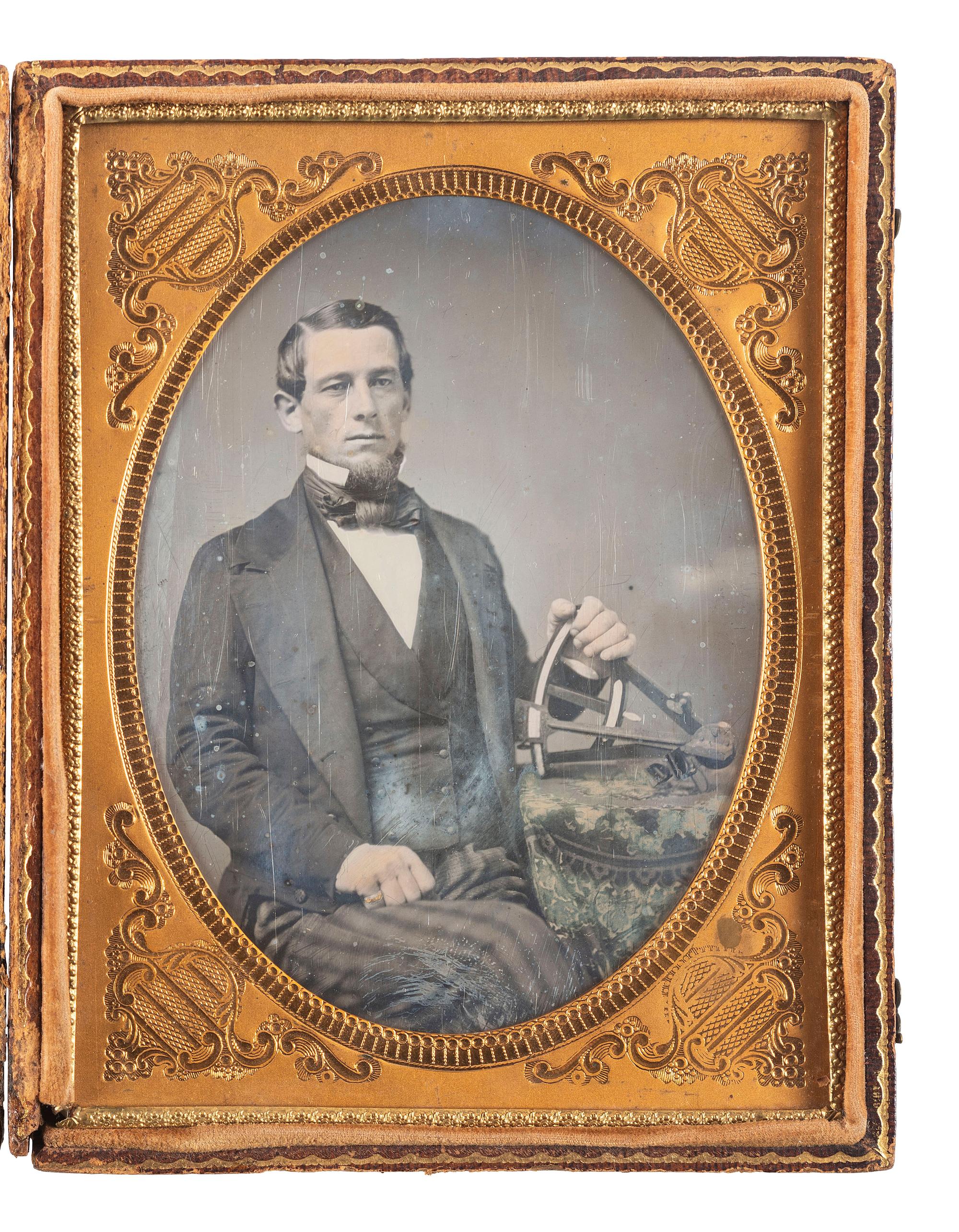 [EARLY PHOTOGRAPHY]. Half plate daguerreotype of a man holding a sextant.
