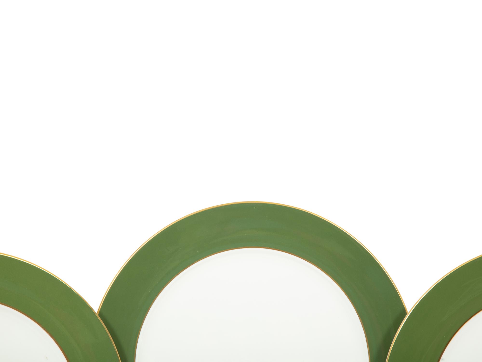 A Set of Fourteen Royal Crown Derby Green Band Chargers