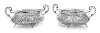 A Pair of German Silver Bonbon Dishes, , the openwork border and body worked to show rocaille, floral and foliate motifs.