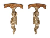 A Pair of Gilt and Silvered Wood Figural Wall Mount Console Brackets — 20TH CENTURY