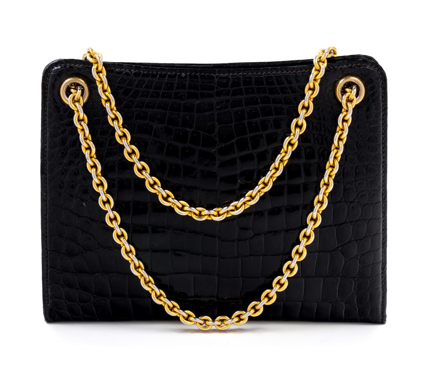 A Gucci Black Crocodile Handbag, 9.5" x 7.5" x 2.5"; Strap drop: 5.5".