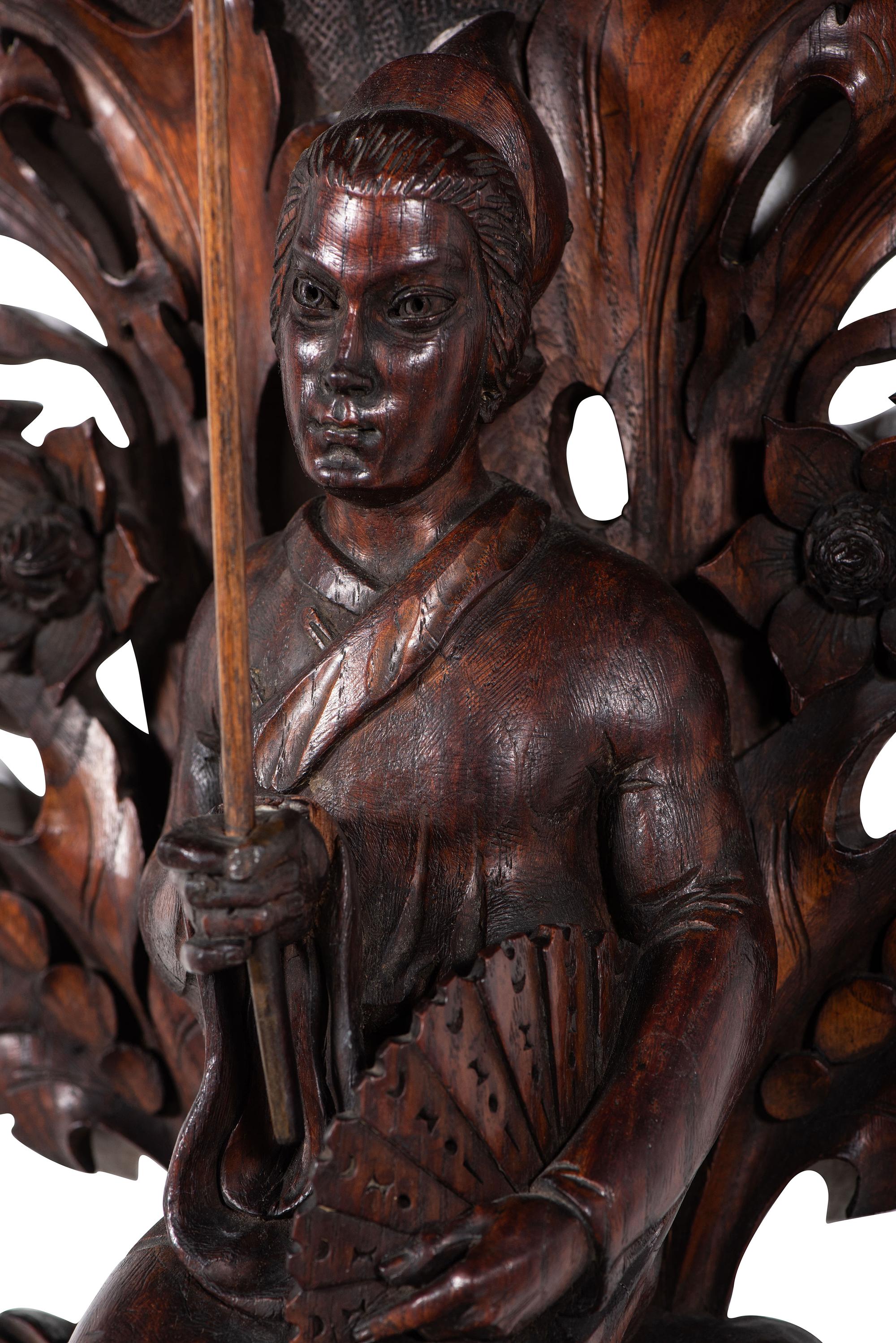 A Pair of Carved Oak Figural Wall Brackets
