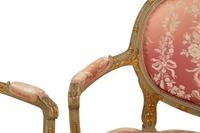 A Louis XVI Style Painted and Parcel Gilt Three-Piece Seating Suite