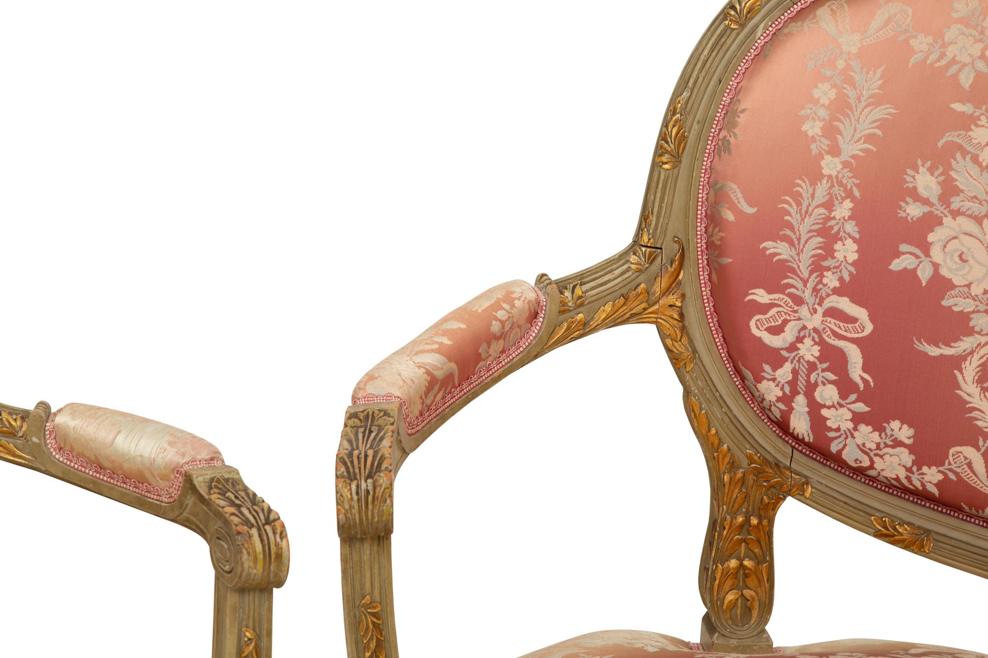A Louis XVI Style Painted and Parcel Gilt Three-Piece Seating Suite