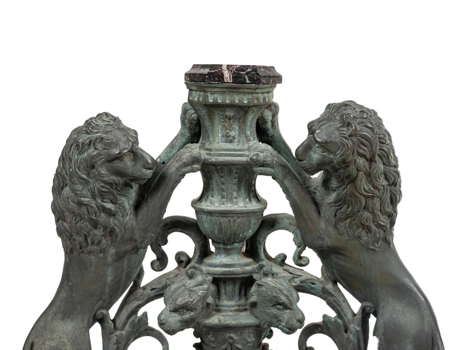 A Pair of Continental Cast Metal Andirons