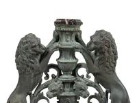 A Pair of Continental Cast Metal Andirons