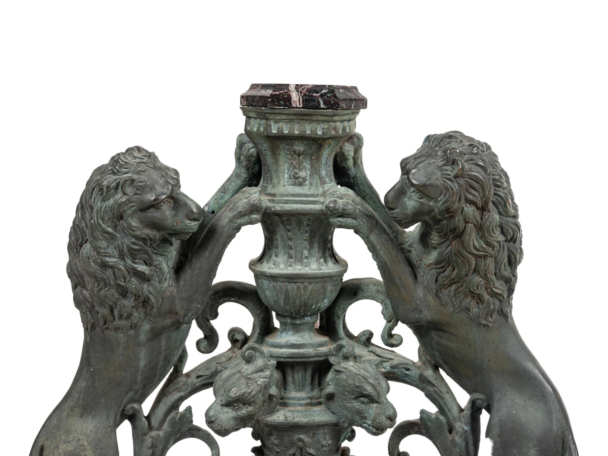 A Pair of Continental Cast Metal Andirons