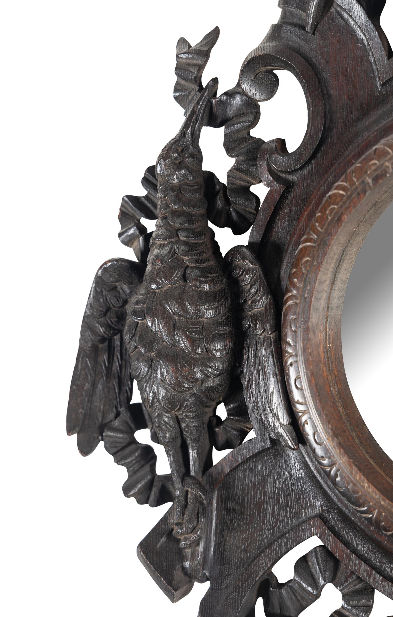 A Black Forest Carved Oak Game Trophy Mirror