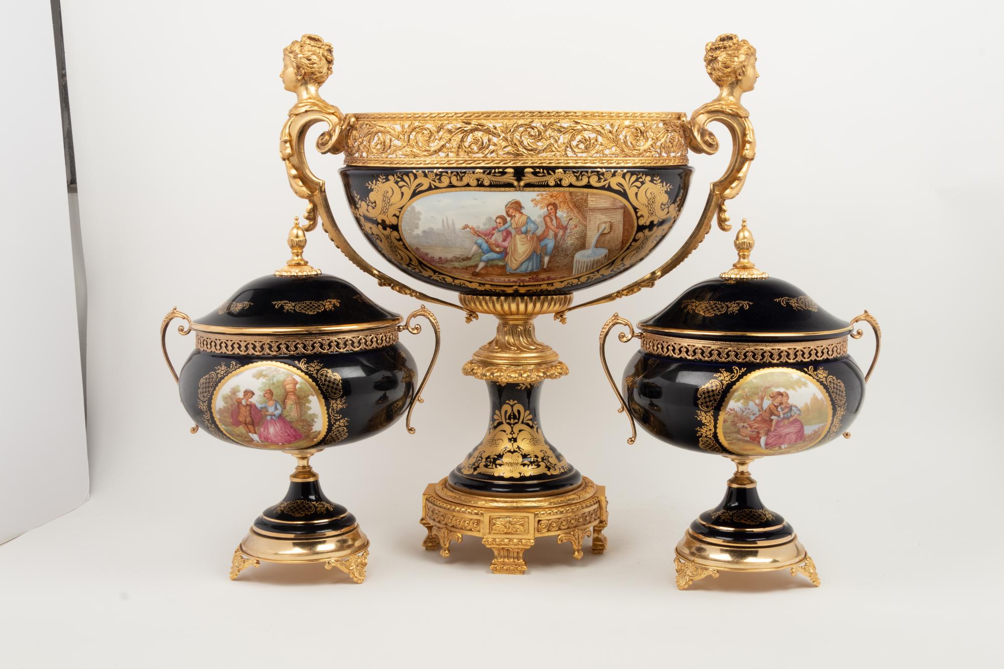 A Louis XV Limoges Style Gilt Bronze Mounted Porcelain Table Garniture