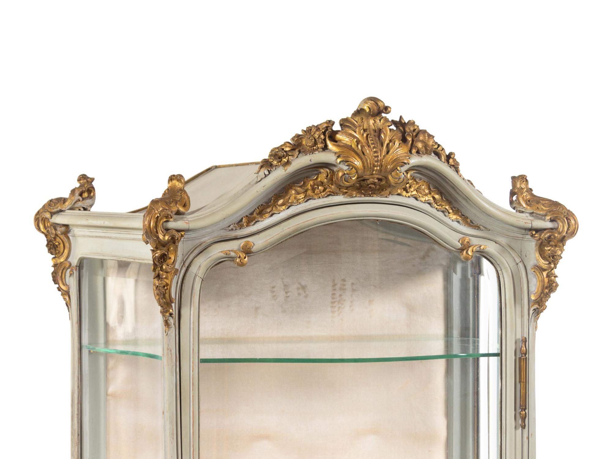 A Louis XV Style Painted and Parcel Gilt Carved Vitrine Cabinet