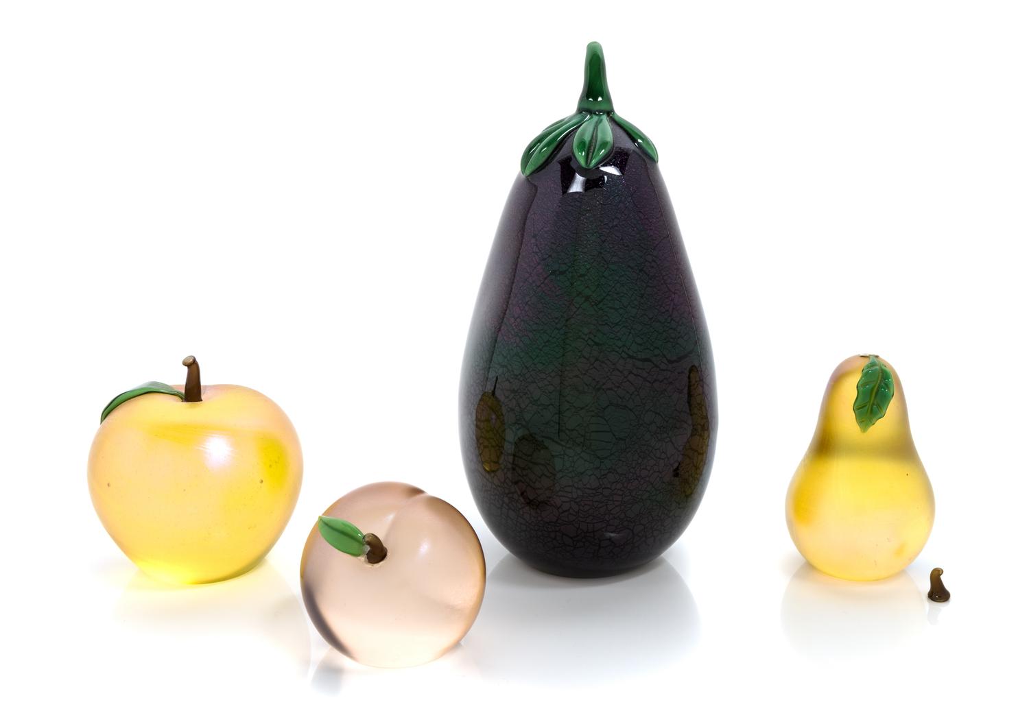 Orient & Flume, CHICO, CA, a group of four glass fruit sculptures, comprising an apple, a peach, a pear and an eggplant