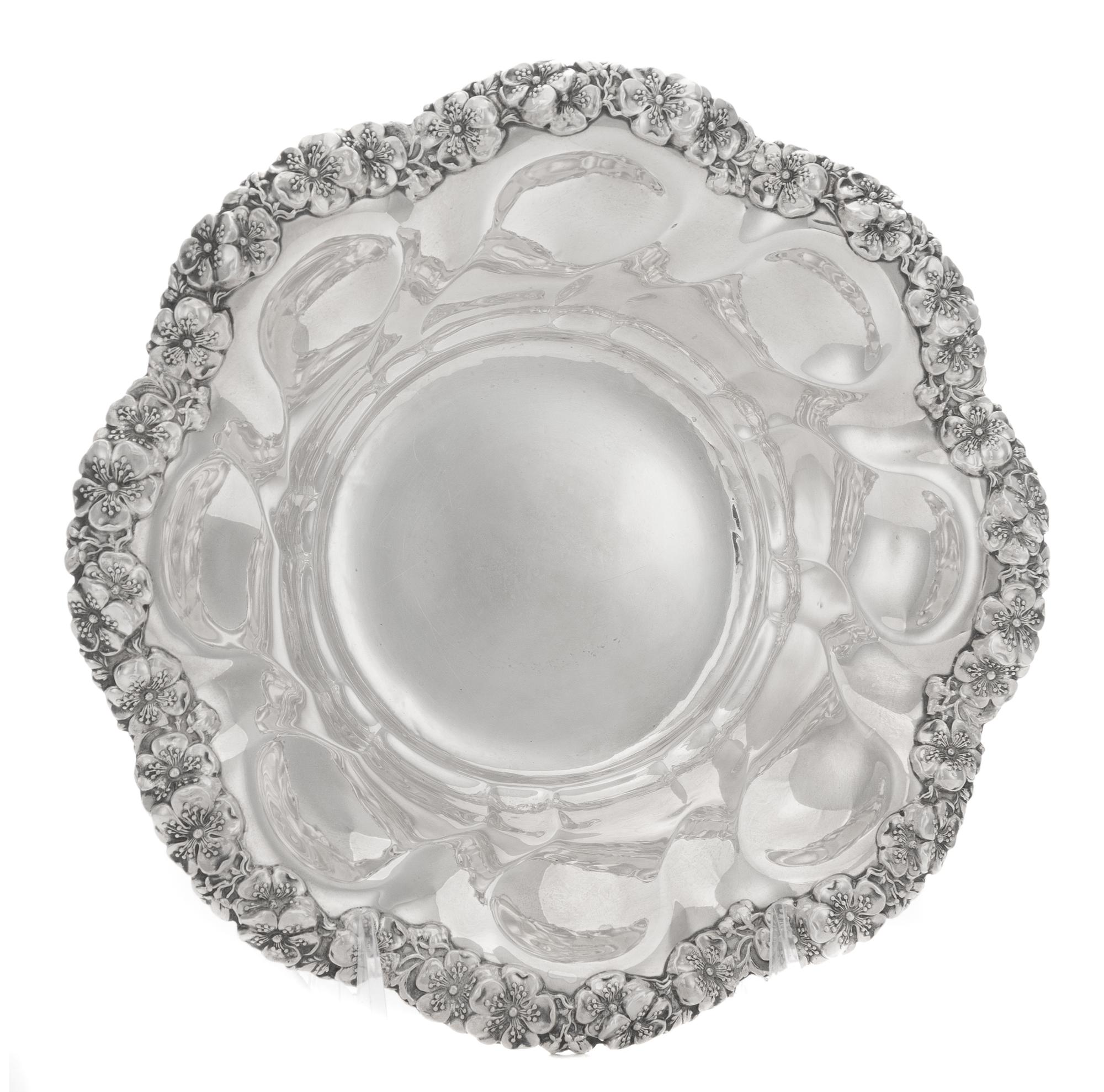 An American Silver Bowl, Alvin Mfg. Co., Providence, RI, with a band of applied flowers at the rim.