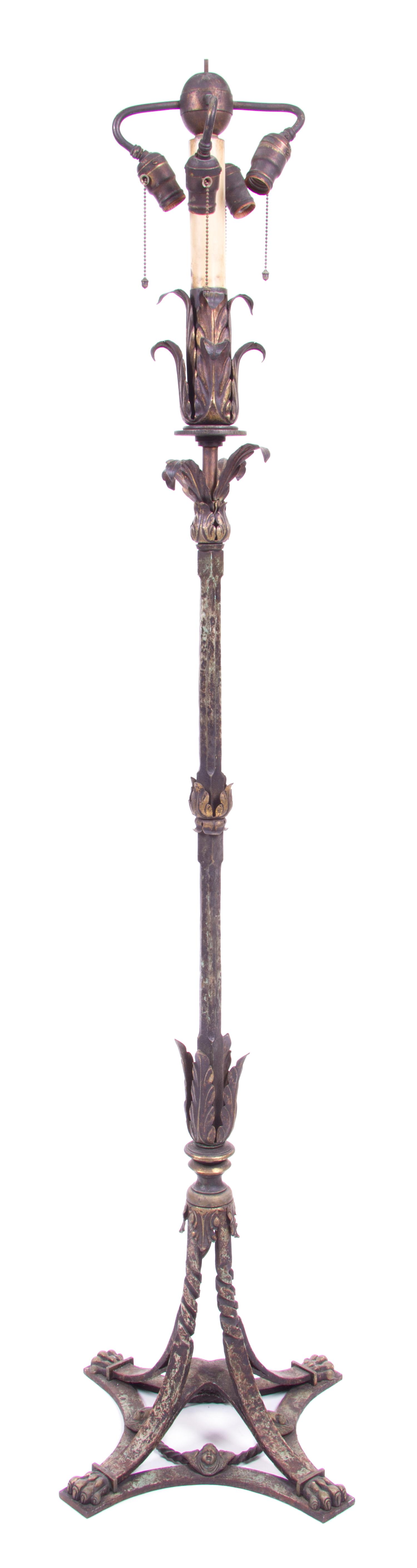 A Wrought Iron and Tole Floor Lamp Height overall 68 1/2 inches. — FIRST HALF 20TH CENTURY