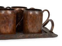 An Arts & Crafts Style Hand Hammered Copper Tray, Pitcher, and Six Mugs — 20TH CENTURY