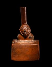 A Chimu-Inca Redware Stirrup Vessel with Squared Body and Human Figure