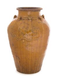 A Brown Glazed Earthenware Vessel Height 21 1/4 inches.