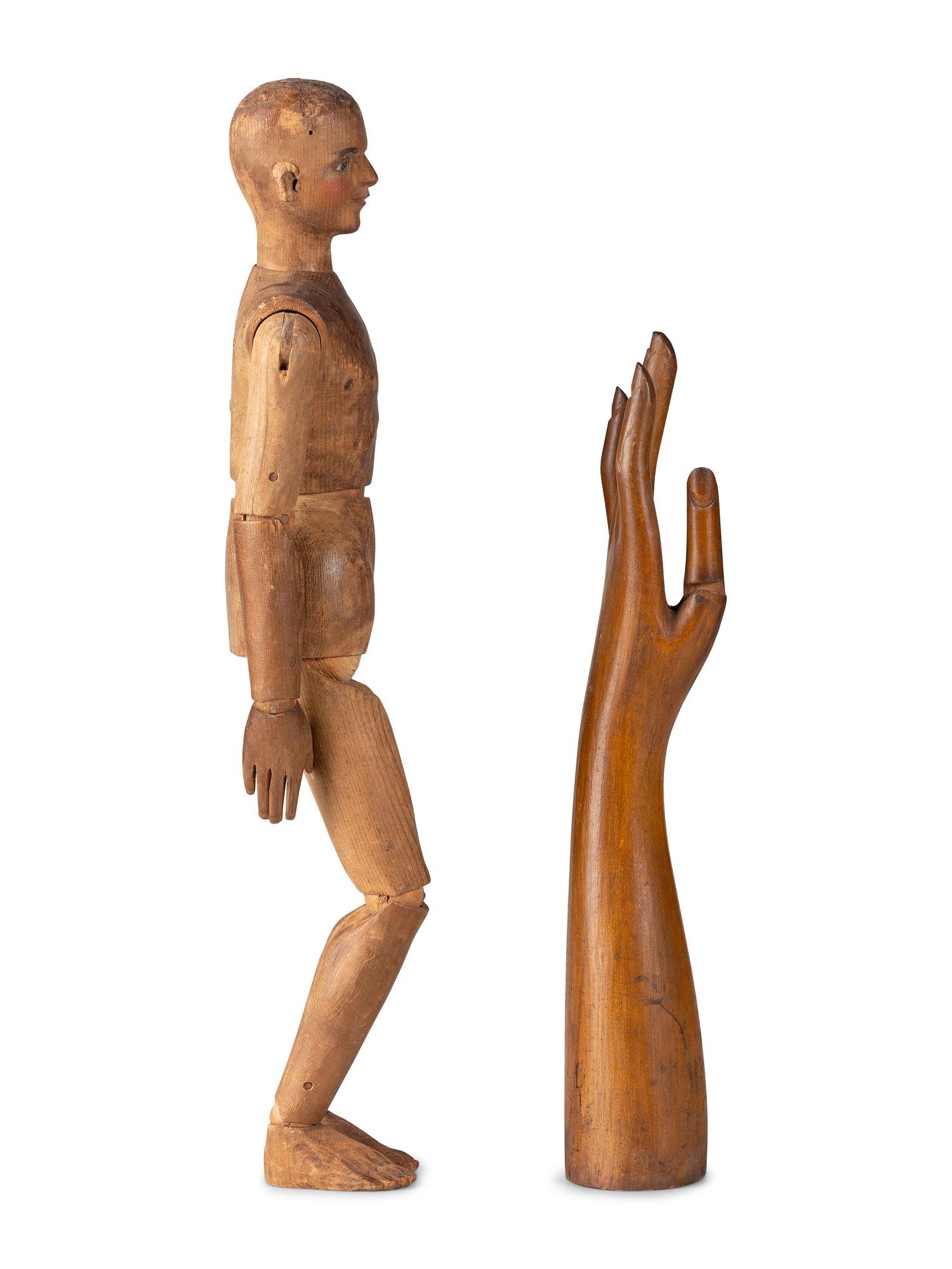 An Articulated Wooden Mannequin and a Carved Wooden Hand with Articulated Thumb