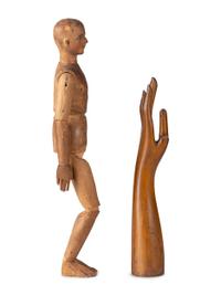 An Articulated Wooden Mannequin and a Carved Wooden Hand with Articulated Thumb