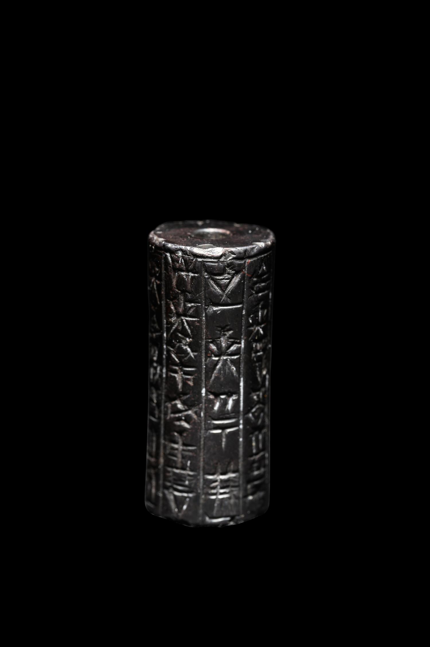 A Mesopotamian Hematite Cylinder Seal