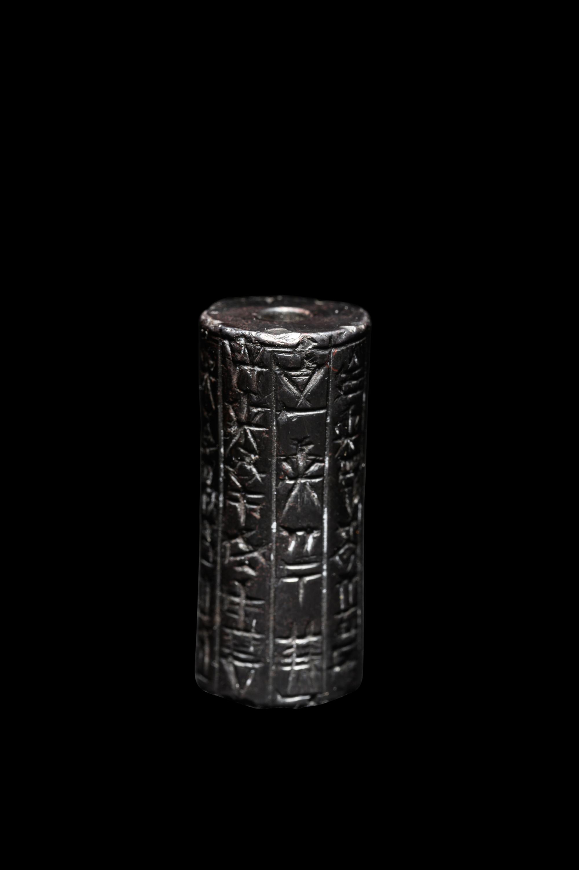 A Mesopotamian Hematite Cylinder Seal