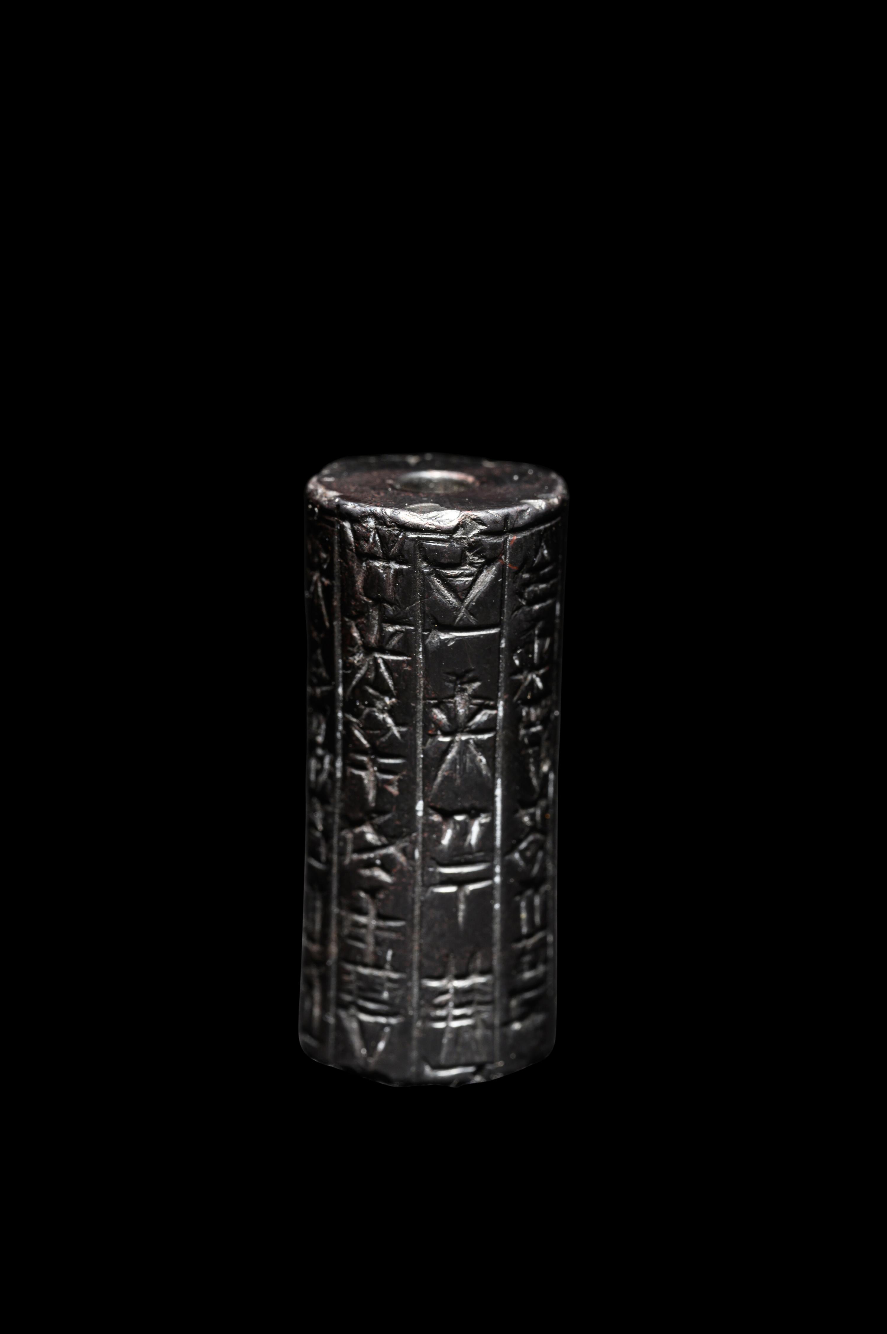 A Mesopotamian Hematite Cylinder Seal